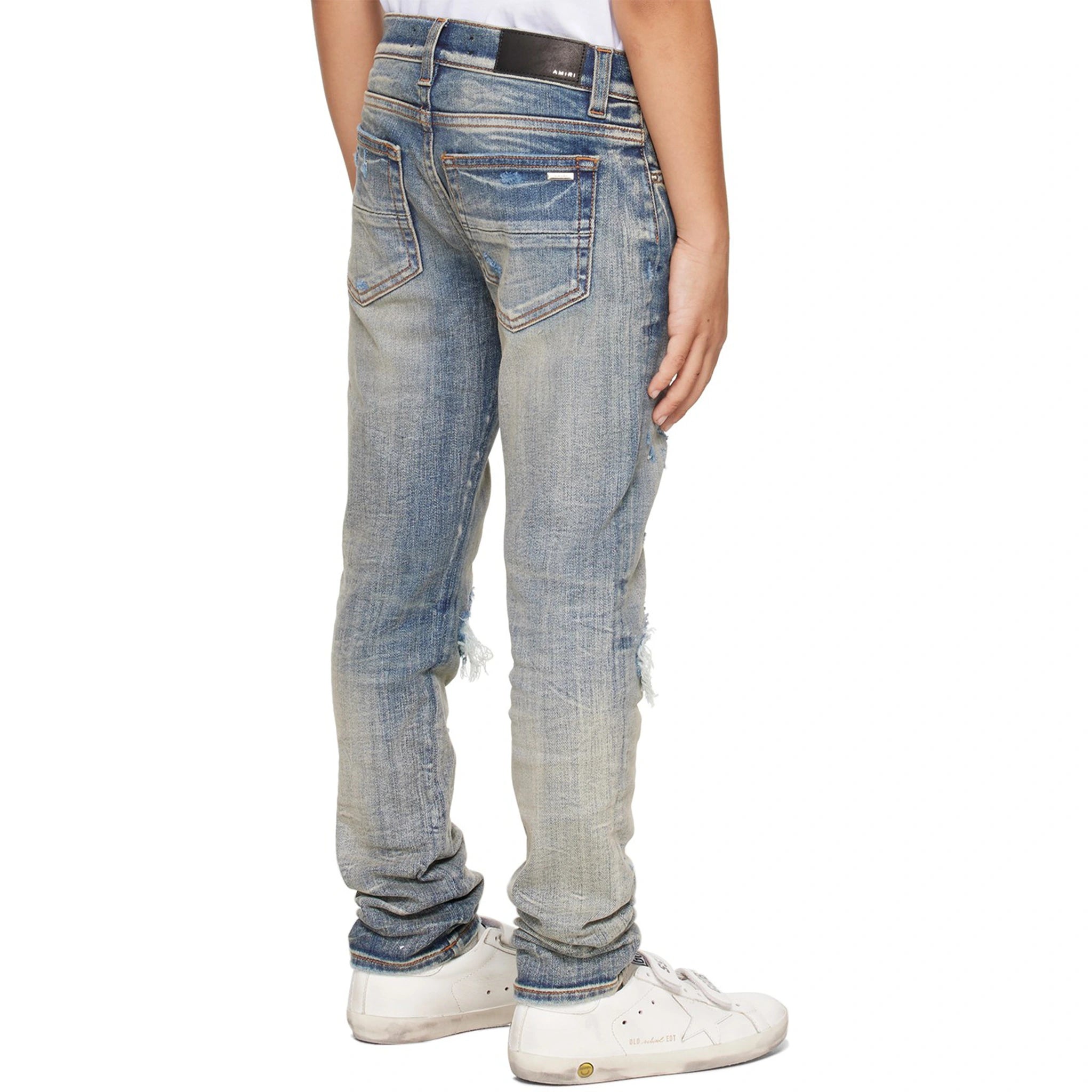 Model back view of Amiri Kids MX1 Clay Indigo Jeans PF22KDS034-408